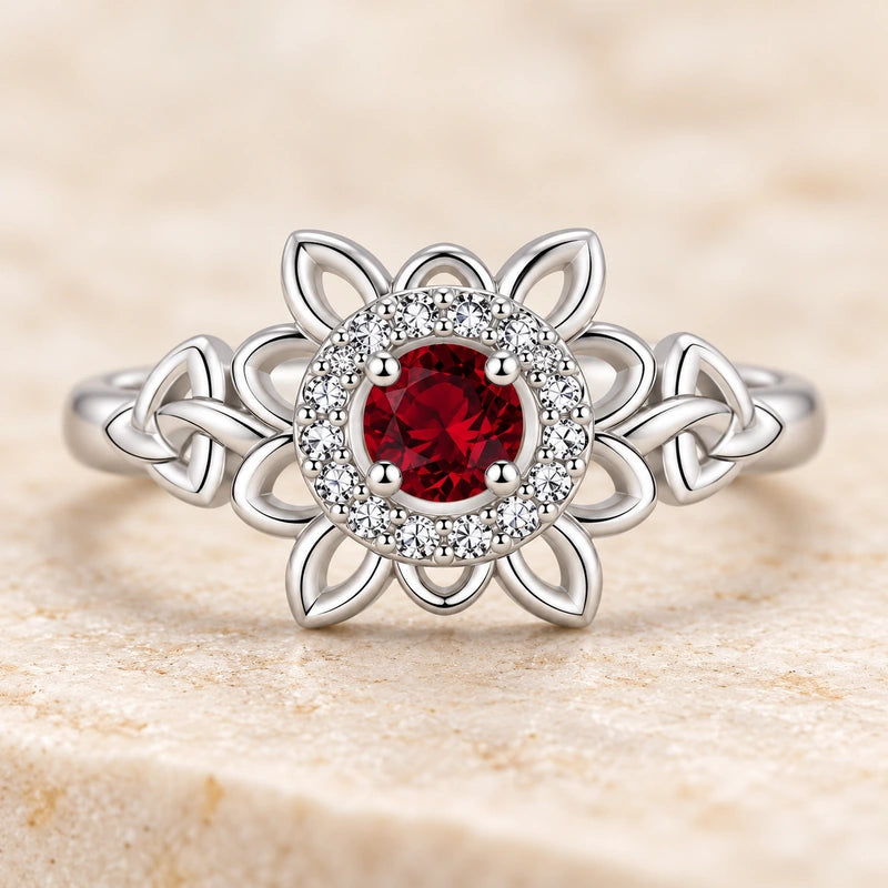 Straight-on front view of the round red center, clear halo and open flower petals